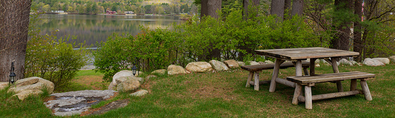 Picnic bench by a lake.