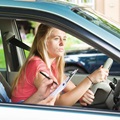A teenager practices driving
