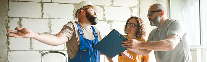 Family makes an agreement with a worker doing renovations in the apartment.