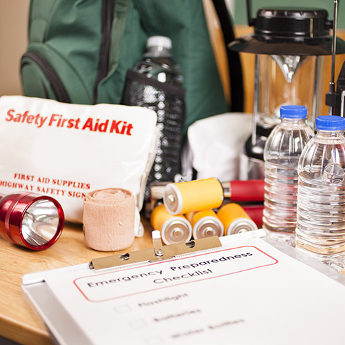A large pile of supplies to be used in case of a natural disaster (hurricane, flood, earthquake, etc.) 
