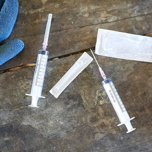 Syringes on table in preparation for vaccine.