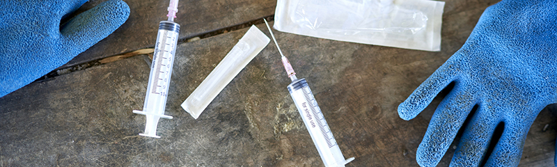 Syringes on table in preparation for vaccine.