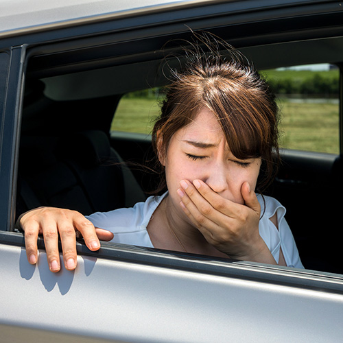 Young woman getting carsickness. 