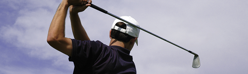 A golfer holding his finish after a great shot.