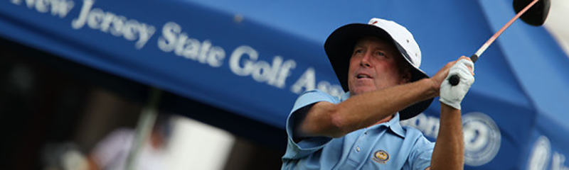 NJSGA Hall of Fame Member Ed Whitman swinging his golf club.