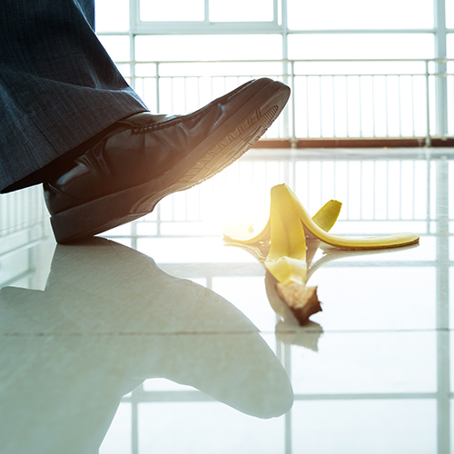 Person slipping on a banana peel.