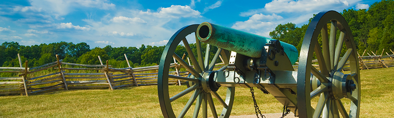 American Civil War bronze cannon weathered with age to a pale greenish hue rests at Gettysburg National Military Park, Gettysburg, Pennsylvania.