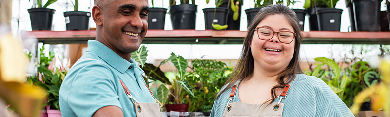 Social inclusion - woman with down syndrome working in small business